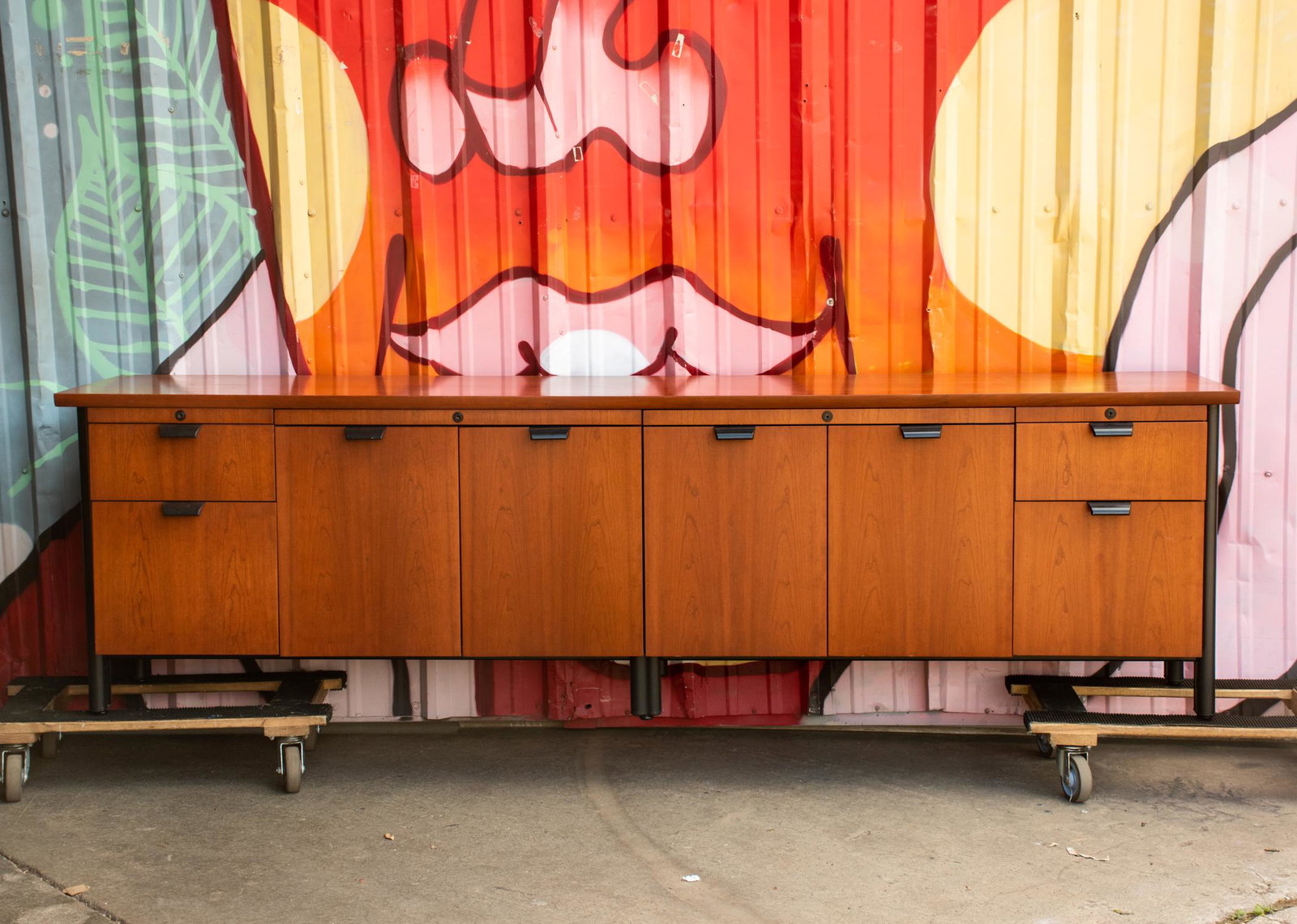 Knoll International Propeller Four Position Credenza: A vintage Knoll International Propeller four position credenza designed by Emanuela Frattini Magnusson. It is constructed of cherry wood veneer having 2 large double-door cabinets with interior shelve