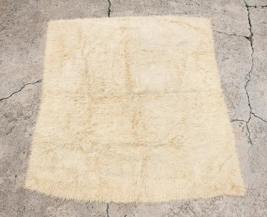 Flokati Shag Wool Area Rug: A large Greek vintage 1970's Flokati natural wool rug that is unmarked.