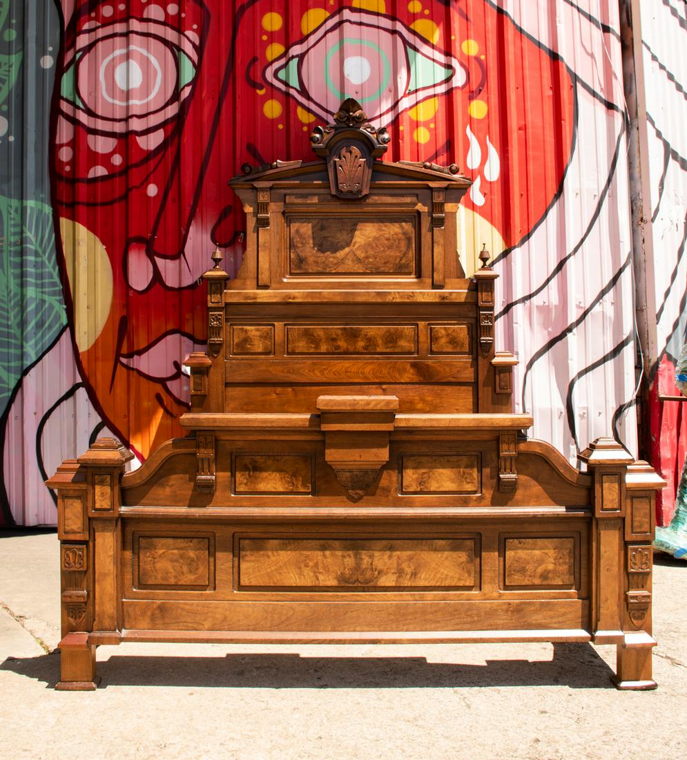 Late Victorian Eastlake Burl Black Walnut Queen Bed: A monumental late 19th Century Victorian period Eastlake style burl and black walnut queen bed. The bed has been professionally converted into a queen by adding an additional section of wood. The bed 