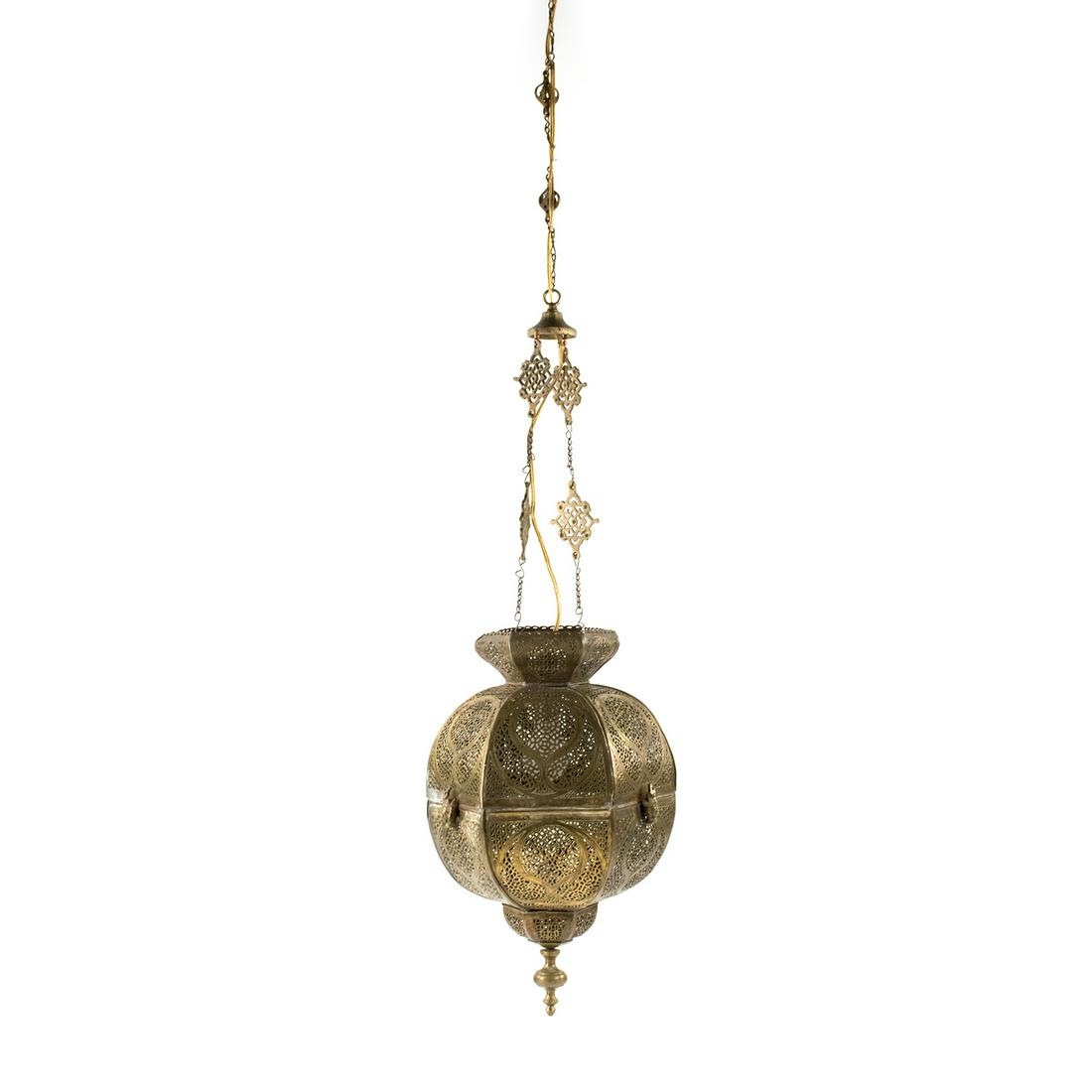 Moroccan Brass Pierced Hanging Lantern: A Moroccan Moorish brass pierced hanging lantern having pierced design with ornate closures and ornate chains for hanging. Includes brass finial. Functional.