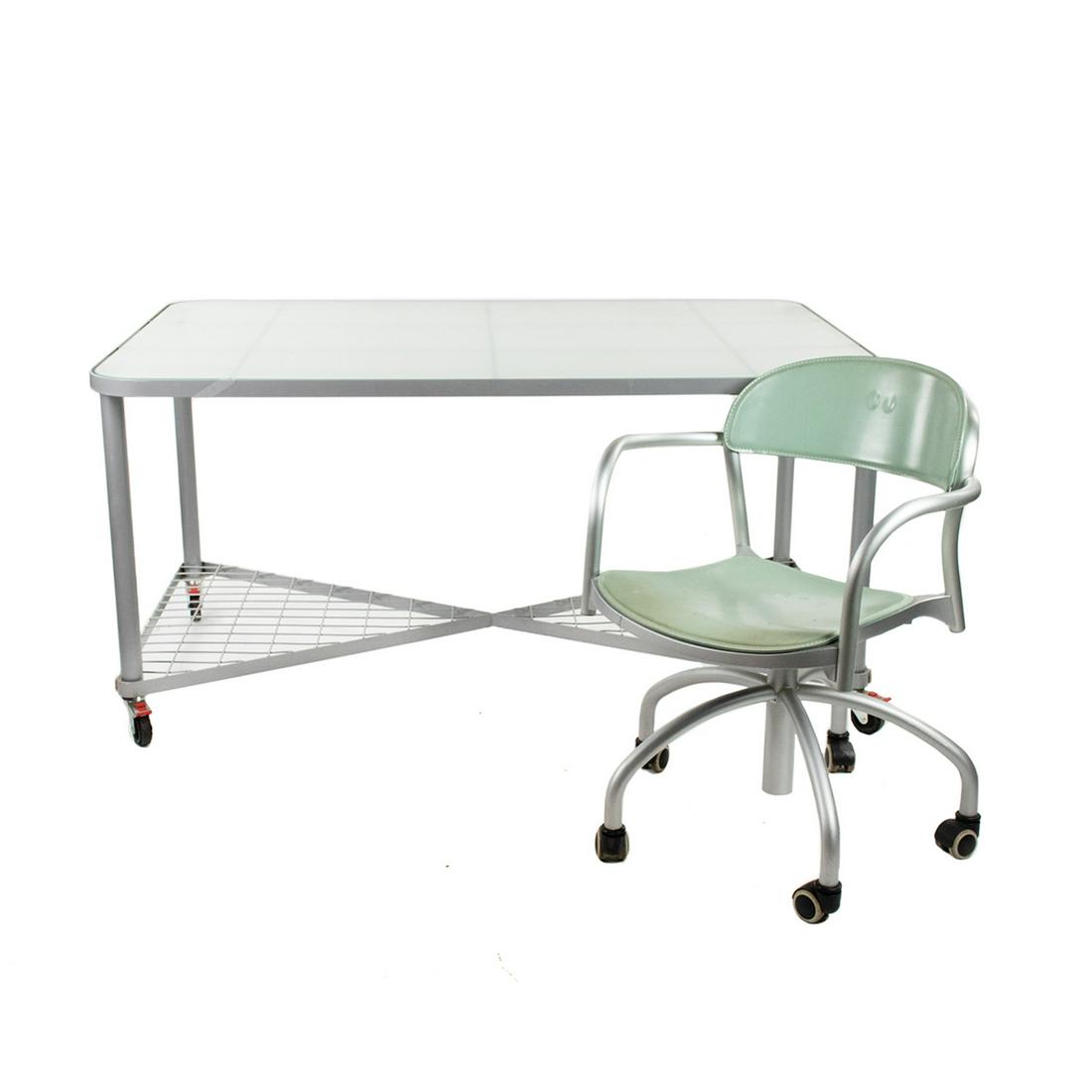 Arper Italian Task Chair and Drafting Desk or Table: An Arper Italian task armchair and large drafting desk or table. The chair has a light green leather upholstery with six legs and plastic wheels marked on the underside and a glass top metal desk or t