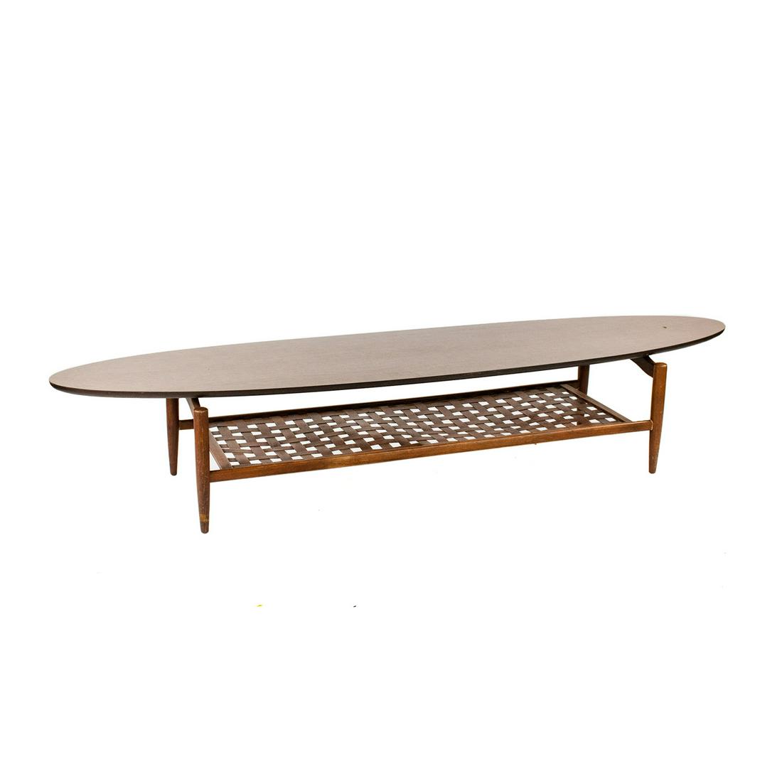 Lane Altavista Surfboard Coffee Table: A Lane Altavista Mid-century Modern surfboard coffee table having surfboard form formica wood veneer top with basketweave woven lower shelf and four tapered legs. Marked on underside.