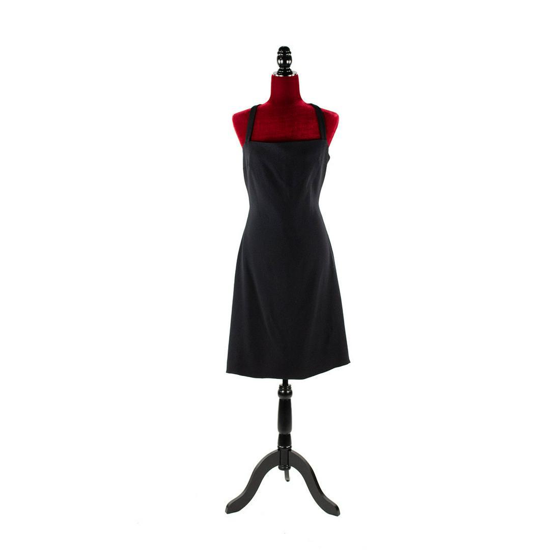 Vintage Giorgio Armani Black Cross Back Dress: Vintage Giorgio Armani black cross back dress having V shaped cross back design and button attachment. Made in Italy, Size 42. Neiman Marcus tag attached.