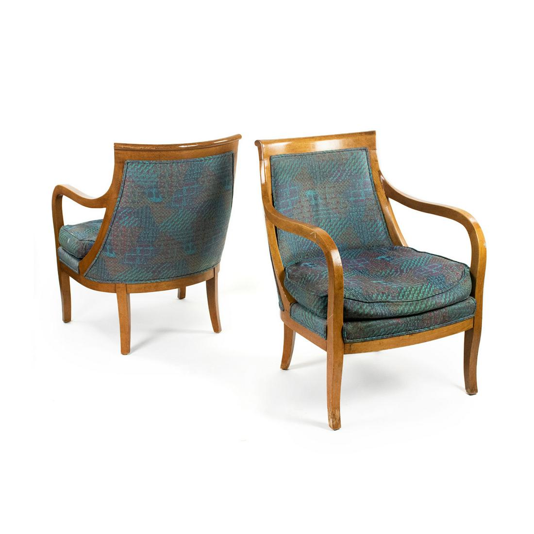 Pair of Biedermeier Bergere Upholstered Armchairs: A pair of Biedermeier Bergere armchairs having curved arms and scrolled back with blue, green and pink upholstery and seat cushions. Unmarked.