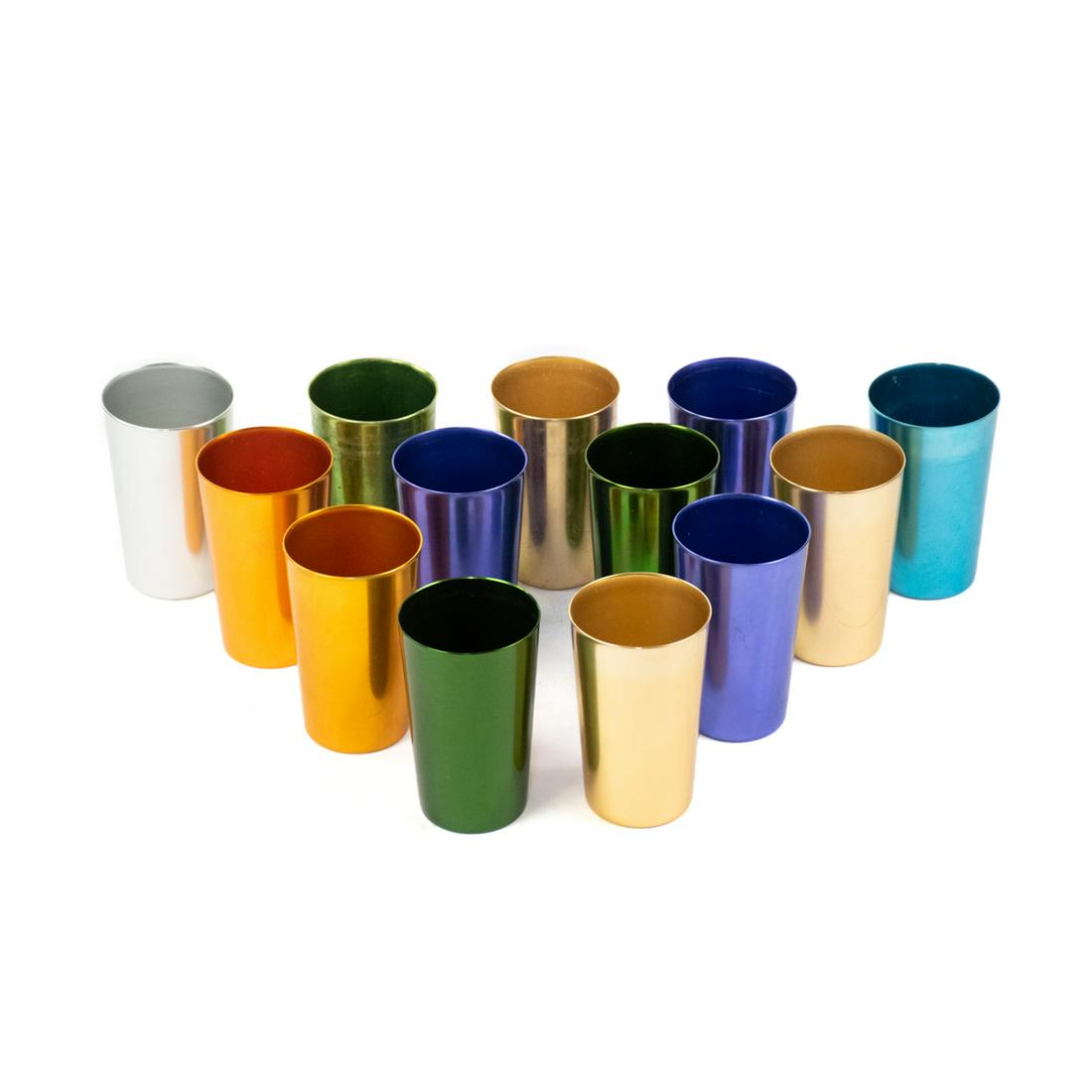 Group of 13 Bascal Italy Multi-Colored Aluminum Cups: Group of 13 Bascal Italy multi-colored aluminum cups or tumblers in green, yellow, gold, silver, light blue and dark blue tones. Marked on undersides.
