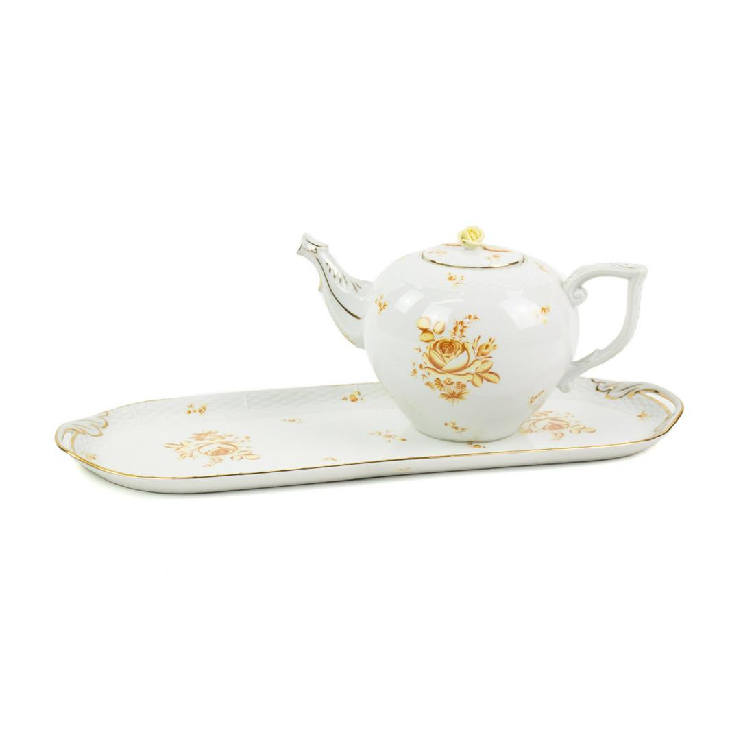 Herend Hungary Yellow Rose Teapot and Platter Set: A Herend Hungary 1942 (Herend Hungaria) yellow rose pattern lidded teapot and matching platter set having painted yellow orange rose motif with yellow rose lid and gold accents. Teapot has impressed "