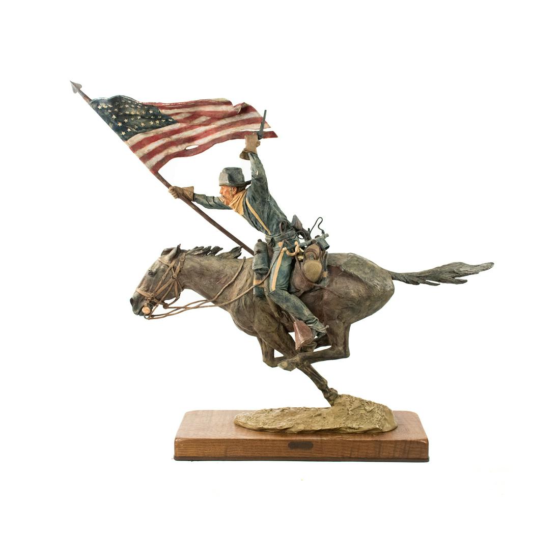 Harry Jackson "The Flagbearer" Signed Bronze Sculpture: A vintage polychrome painted bronze sculpture by Harry Jackson (American, 1924-2011) circa 1983 titled "The Flagbearer" depicting a soldier riding a horse with a pistol in one hand and an American fla