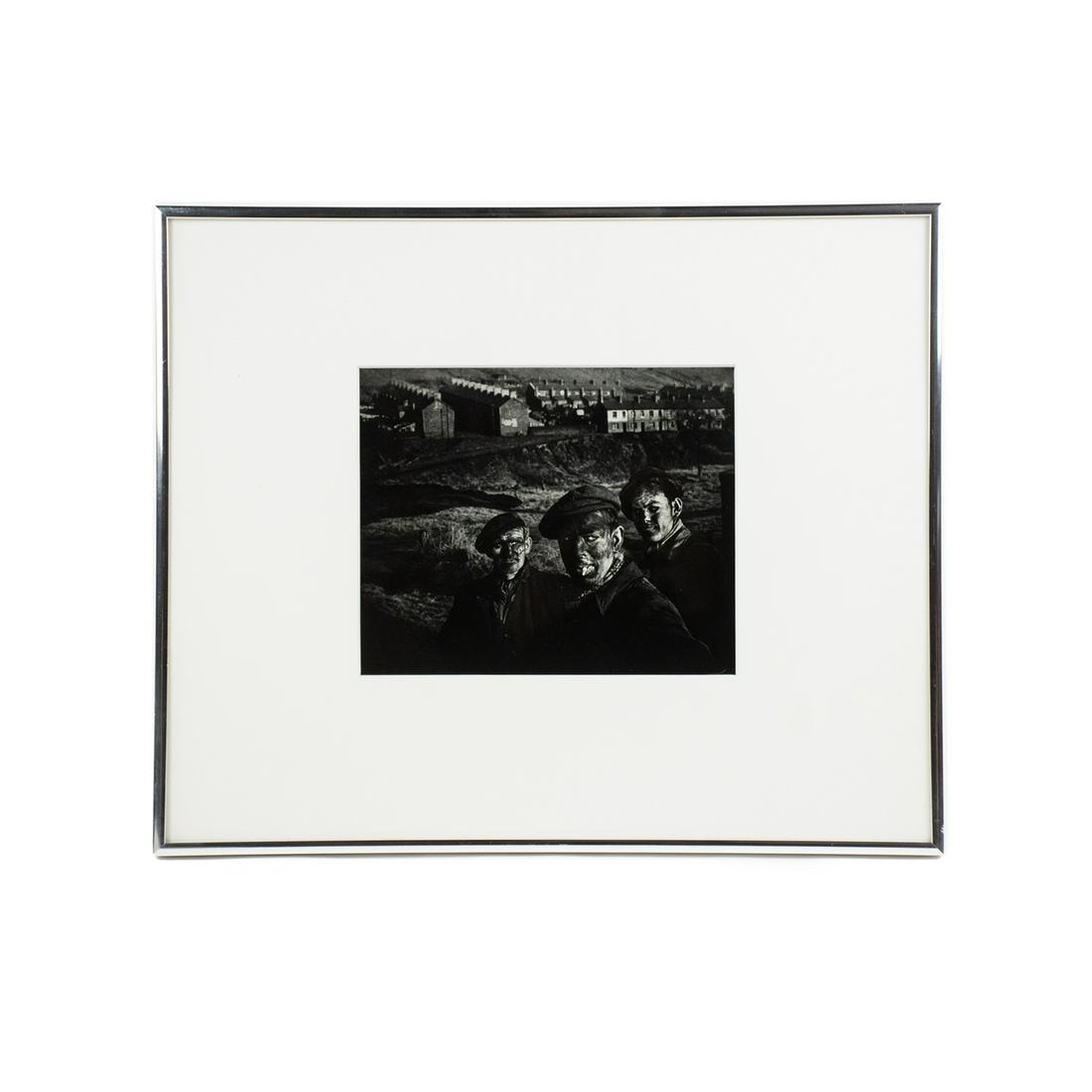 W. Eugene Smith 'Welsh Mining Story' Authentic: An original 1950 silver gelatin photograph 'Welsh Mining Story' by W. Eugene Smith (American, 1918-1978) depicting three generations of Welsh coal miners posed in a photo for Life Magazine. Stamped on