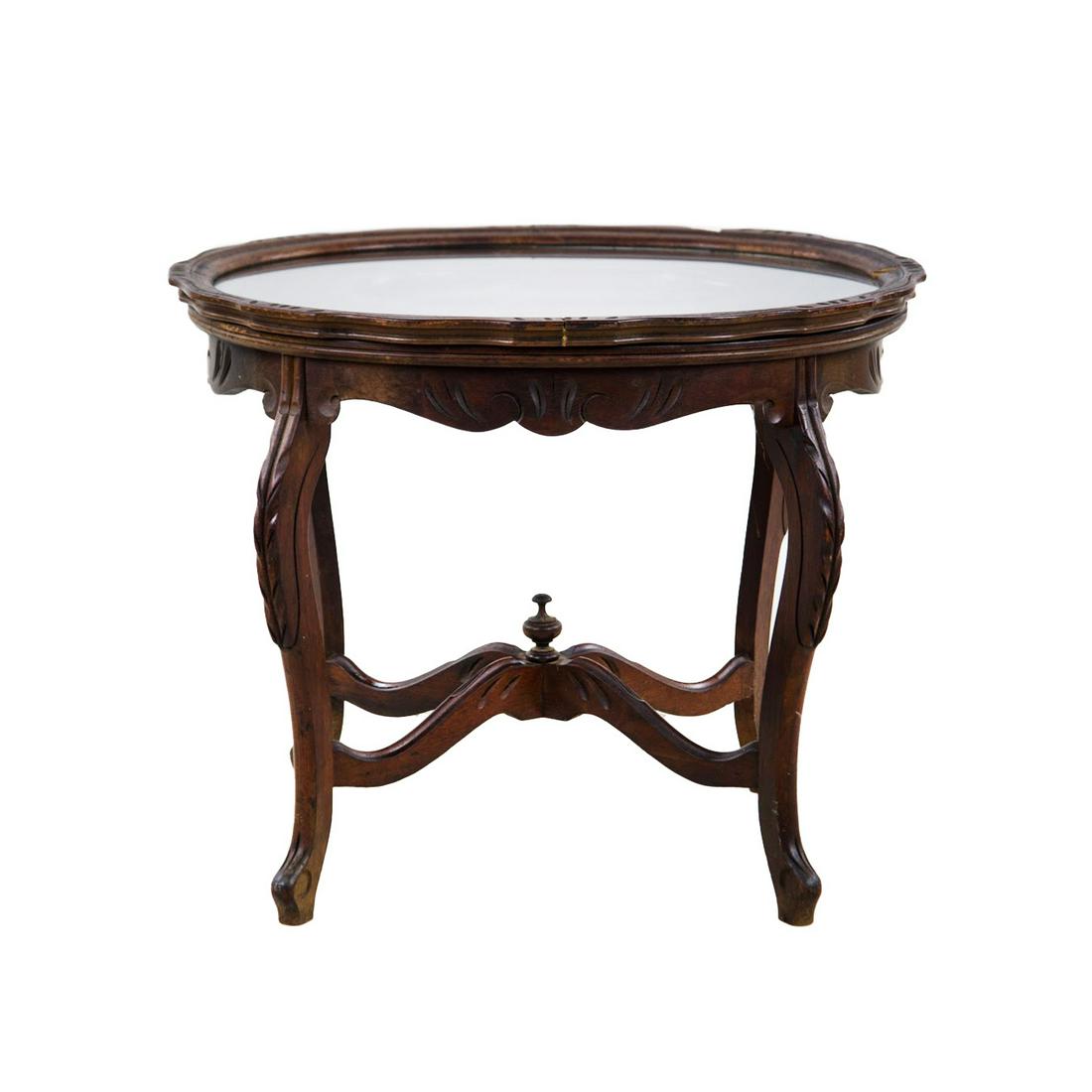 French Style Tray Top Coffee Table: A 19th century French walnut serving tray top side or occasional table having carved female reclining figure on table with glass top. The shelf and 4 legs are simply carved with small repeating notche