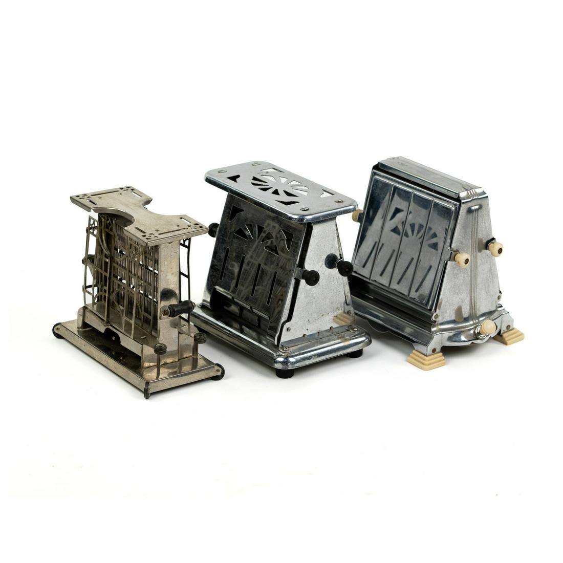(3) Grouping of 3 Antique Metal Toasters: A grouping of three (3) antique metal toasters including a Landers, Frary & Clark model E947 two-slice toaster, a Landers, Frary & Clark model 75312A two-slice toaster, and a Manning-Bowman & Co. two-