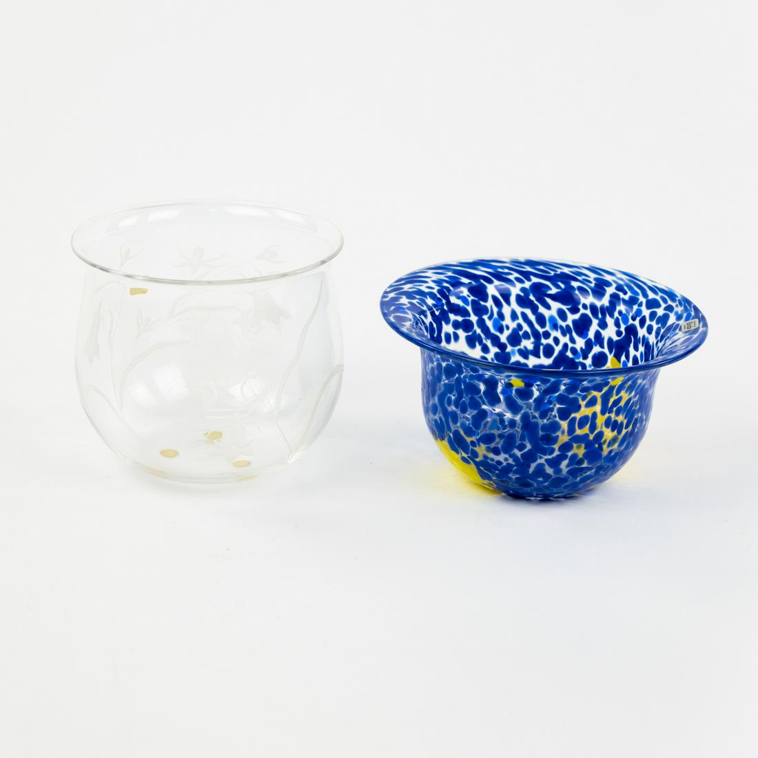 (2) Grouping of Glass Bowls incl. Kosta Boda: A grouping of two glass bowls including a blue and yellow dappled hand-blown Kosta Boda Sweden bowl and a clear glass bowl with etched floral and leaf design. Kosta Boda bowl is etched on underside.