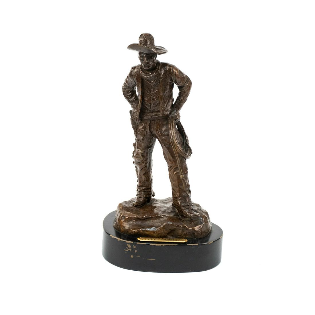 Harry Jackson "Salty Dog" Signed Bronze Sculpture: A vintage bronze sculpture by Harry Jackson (American, 1924-2011) circa 1959 titled "Salty Dog" depicting a Western cowboy carrying a lasso raised atop a black wooden base. It is signed and dated.