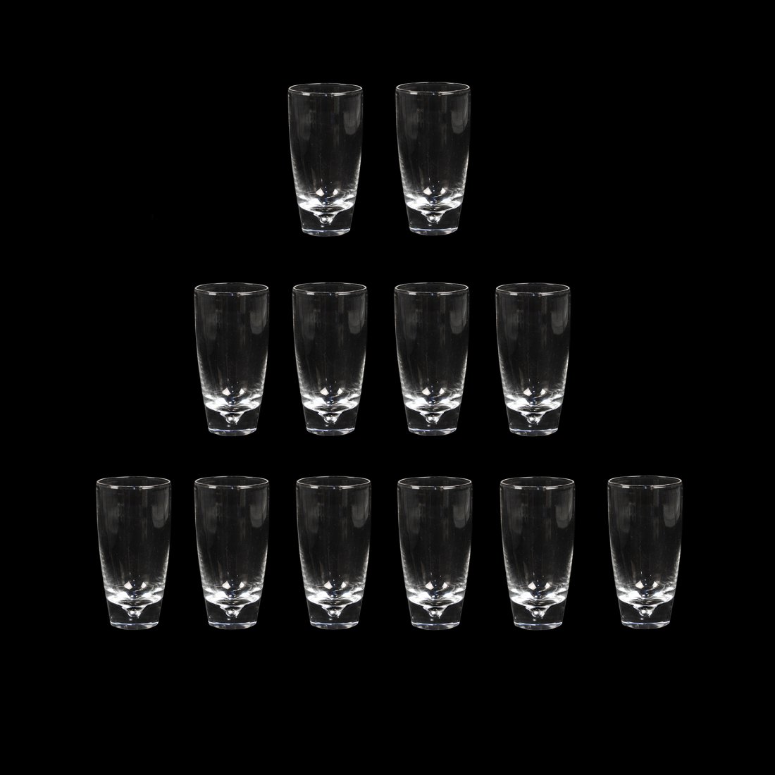 (12) Set of 12 Steuben Glass Crystal Tumblers #7940: A set of 12 Steuben Glass crystal flat tumblers #7940 having simple design in bottom of glass. Glasses are 8 oz each and include original box and individual cloth bags. Etched on undersides. Measureme