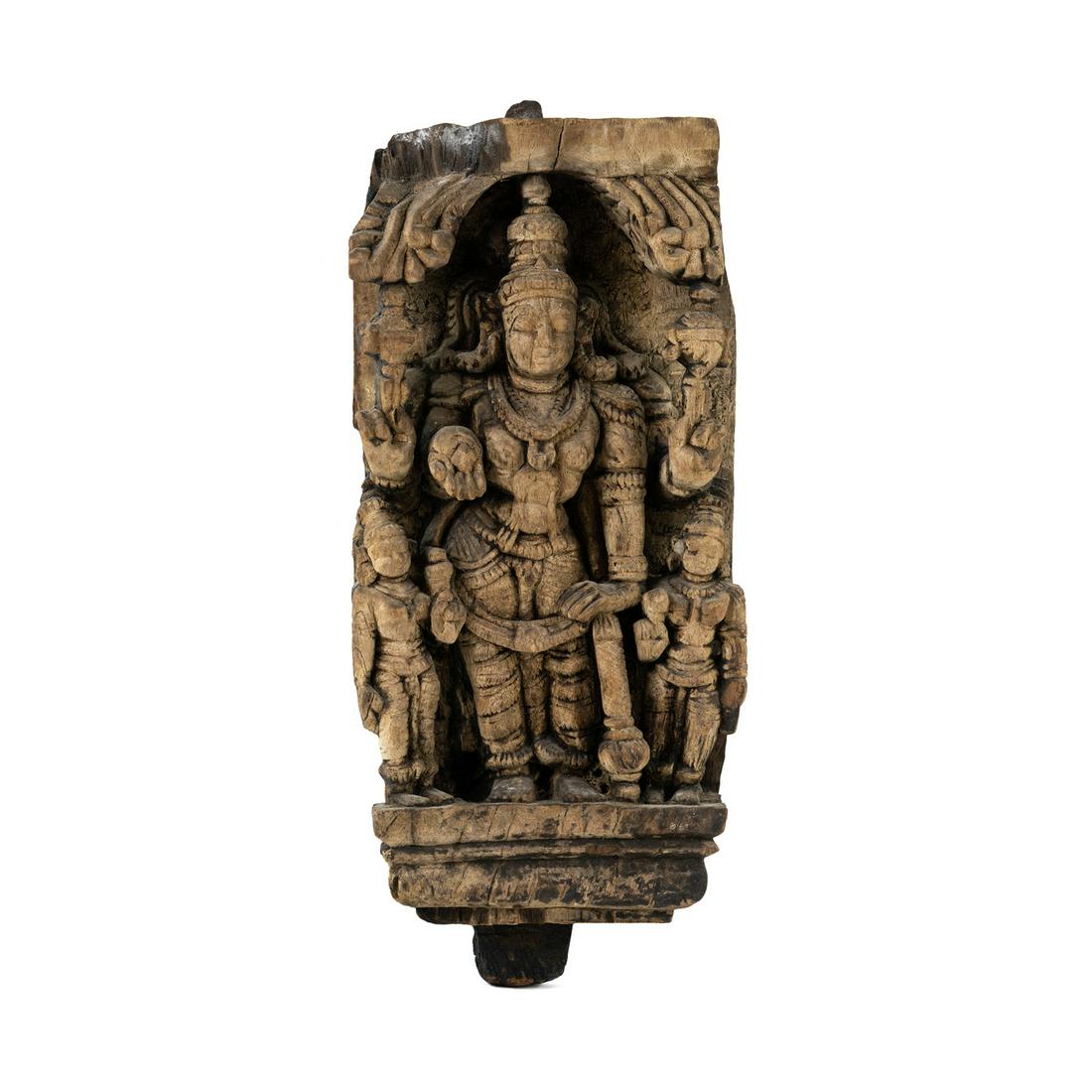 Early Deity God Lord Shiva Chariot High Relief Carving: An Indian chariot carved panel depicting the Hindu deity god Lord Shiva carved in high relief posing with his arms outstretched holding an attribute in his right hand surrounded by devotees or attenda