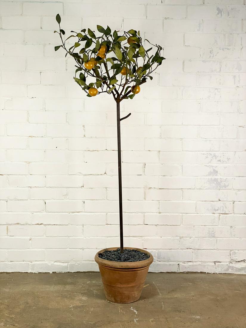 Italian Tole Lemon Tree: An Italian toleware lemon tree supported by a pottery planter filled with decorative stones. SHIPPING Atlanta Auction Gallery will not ship this lot in house. The buyer is responsible for arranging Wh