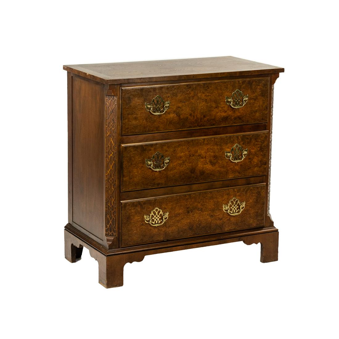 Chinese Chippendale Style Bachelor's Chest by Baker: A Baker Furniture Company Chinese Chippendale style Bachelor's chest having burl walnut bookmatched veneer and border with Georgian style brass pulls and carved fretwork panels on each corner. SHIPPIN