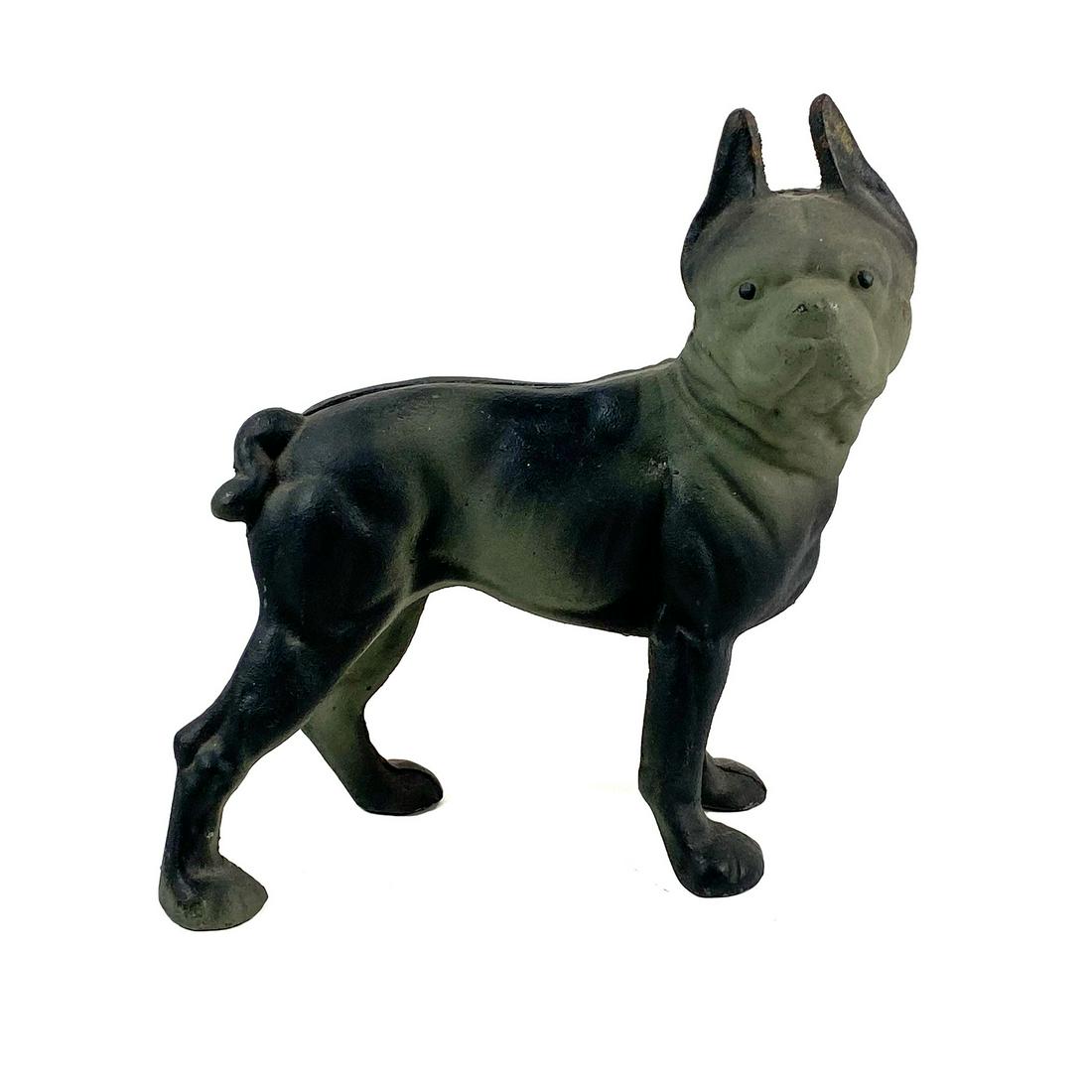 Cast Iron Boston Terrier Doorstop: A Boston Terrier doorstop with two cast iron halves held together with screws.