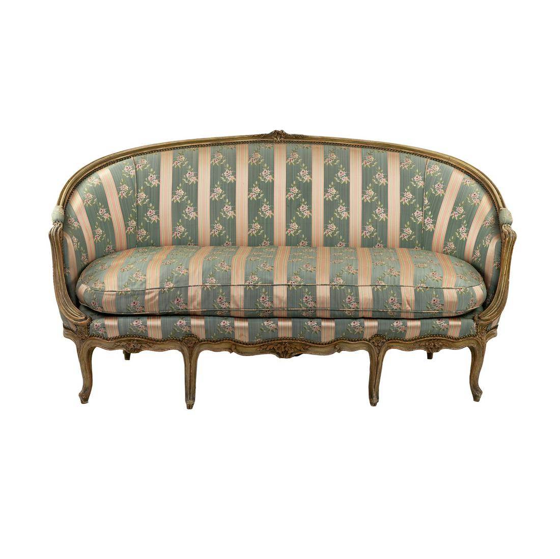 Antique French Louis XV Style Silk Canape Sofa: An antique French Louis XV style canape sofa having a blue and pink striped upholstery with floral detail and feather down filled cushion atop seven carved cabriole legs. SHIPPING Atlanta Auction Gall