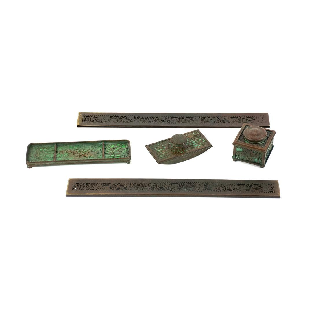 Tiffany Studios Grapevine and Pine Needle 5 Pcs Desk: A Tiffany Studios circa 1900 (5) five piece desk set including 2 Blotter Ends Grapevine pattern impressed 'Tiffany Studios New York 999', 1 Inkwell Pine Needle pattern impressed 'Tiffany Studios New Y