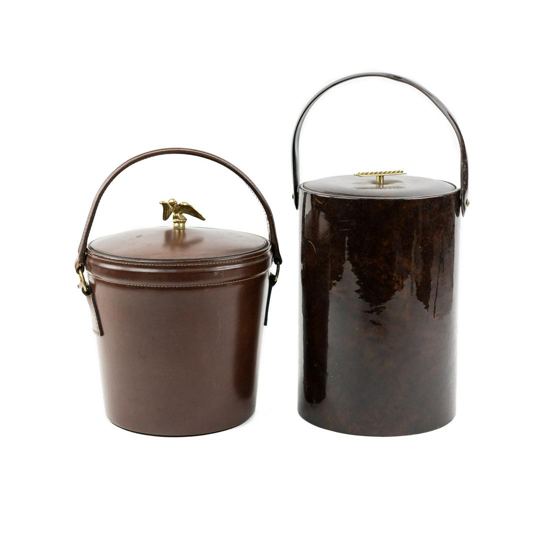 Bosca and Georges Briard Ice Buckets: A group of 2 ice buckets including a Bosca leather ice bucket having a leather covered lid with an eagle finial and a plastic interior lining, stamped on the underside 'Bosca'. This lot also includes