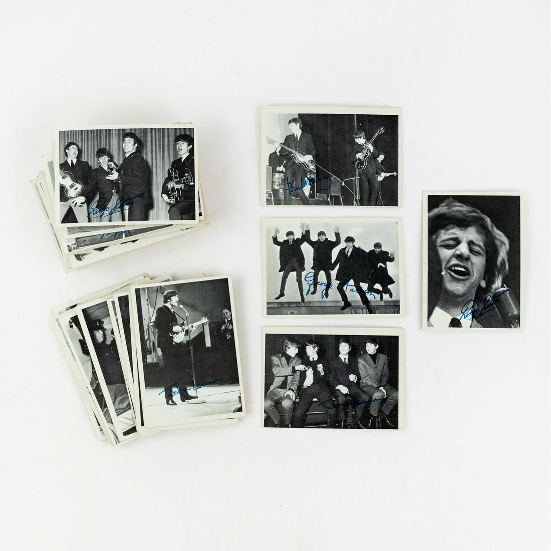 (51) 1964 Topps 3rd Series Beatles Trading Cards: A group of 51 Topps 1964 3rd series Beatles black and white photo trading cards featuring portraits of band members, each having a blue facsimile autograph from either John Lennon, Paul McCartney, Geo