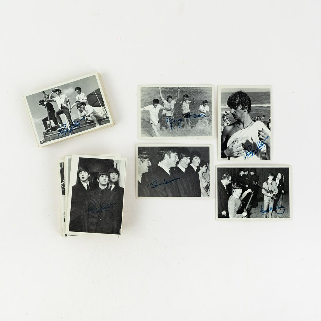 (51) 1964 Topps 3rd Series Beatles Trading Cards: A group of 51 Topps 1964 3rd series Beatles black and white photo trading cards featuring portraits of band members, each having a blue facsimile autograph from either John Lennon, Paul McCartney, Geo