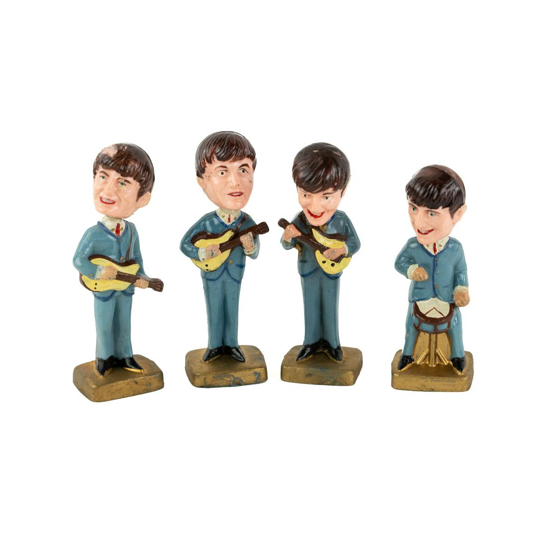 1960's Beatles Bobblehead Cake Toppers: A set of 4 1960's bobblehead cake toppers including John, Paul, Ringo, and George, each marked "Made in Hong Kong" on bottom.