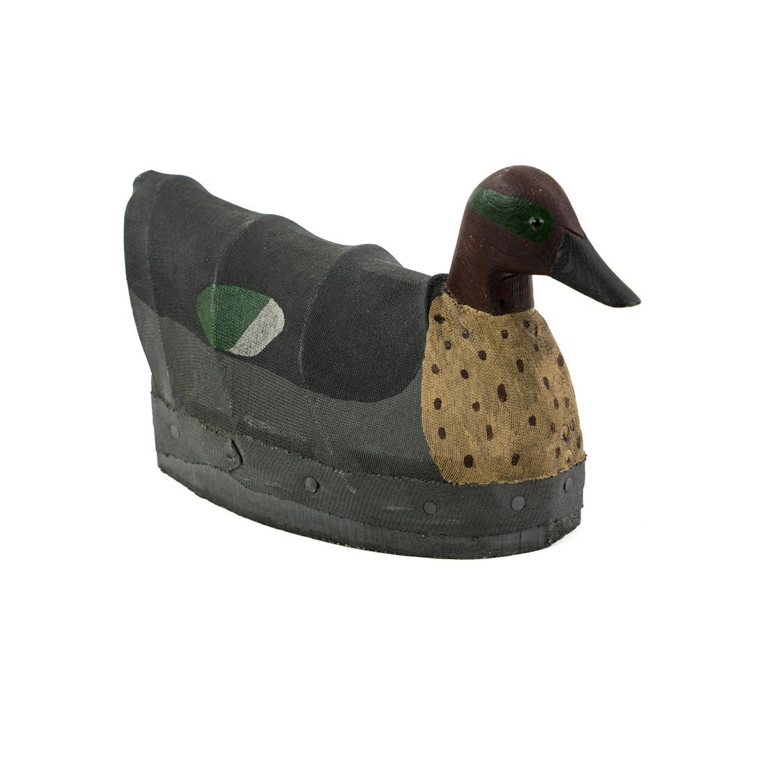 William Moseley Hand-Carved Wood and Canvas Duck Decoy: A hand-carved, hand-painted wood and canvas over wire frame duck decoy with carved initials 'W.M.' on the underside, presumably by William Moseley.