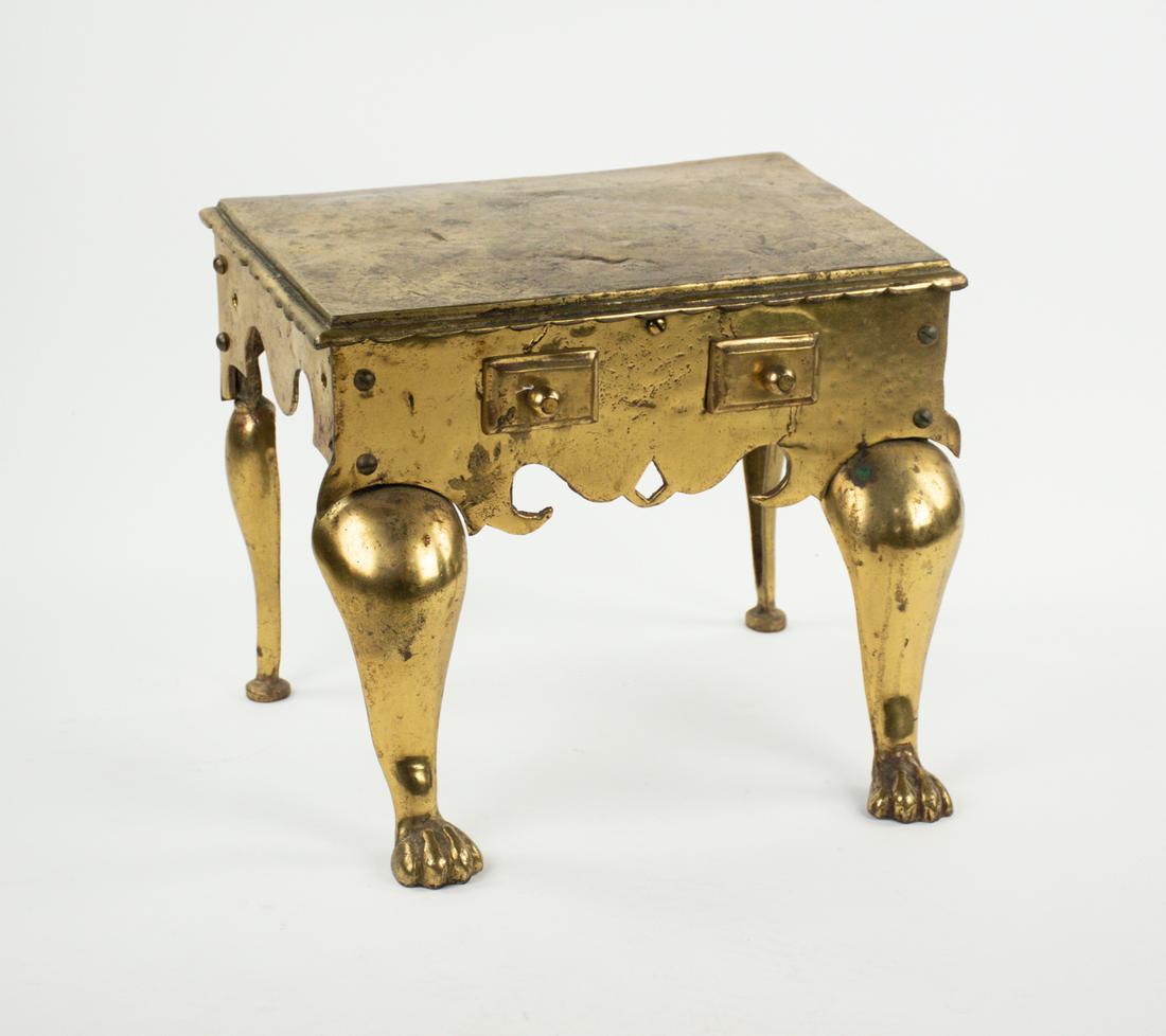 Antique English Brass Fireplace Kettle Footman: An antique 19th century heavy brass fireplace kettle stand or footman having claw-foot legs.