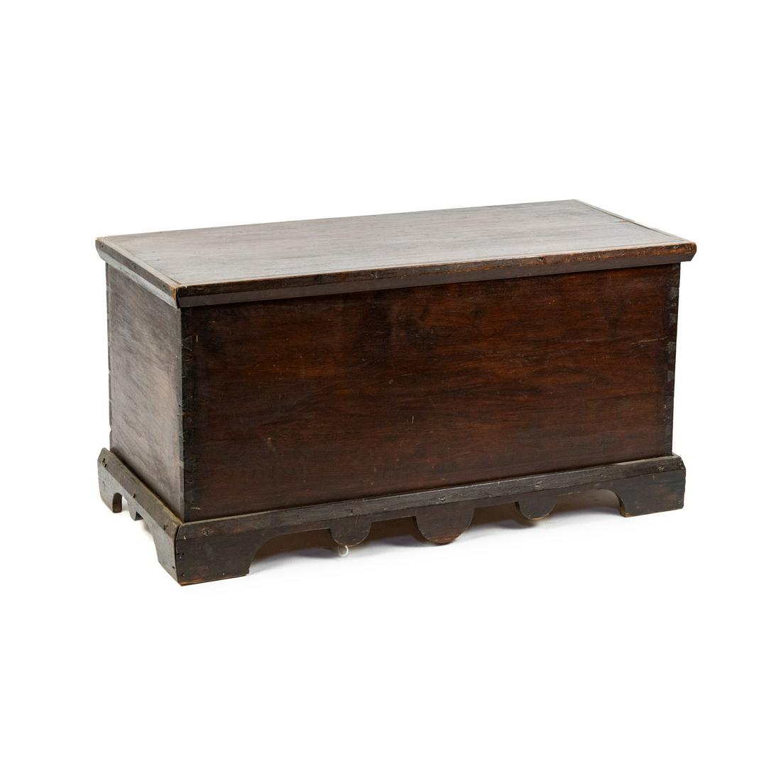 19th American Primitive Trunk: A 19th century American primitive trunk constructed of large planks with simple attached trim and scalopped base.