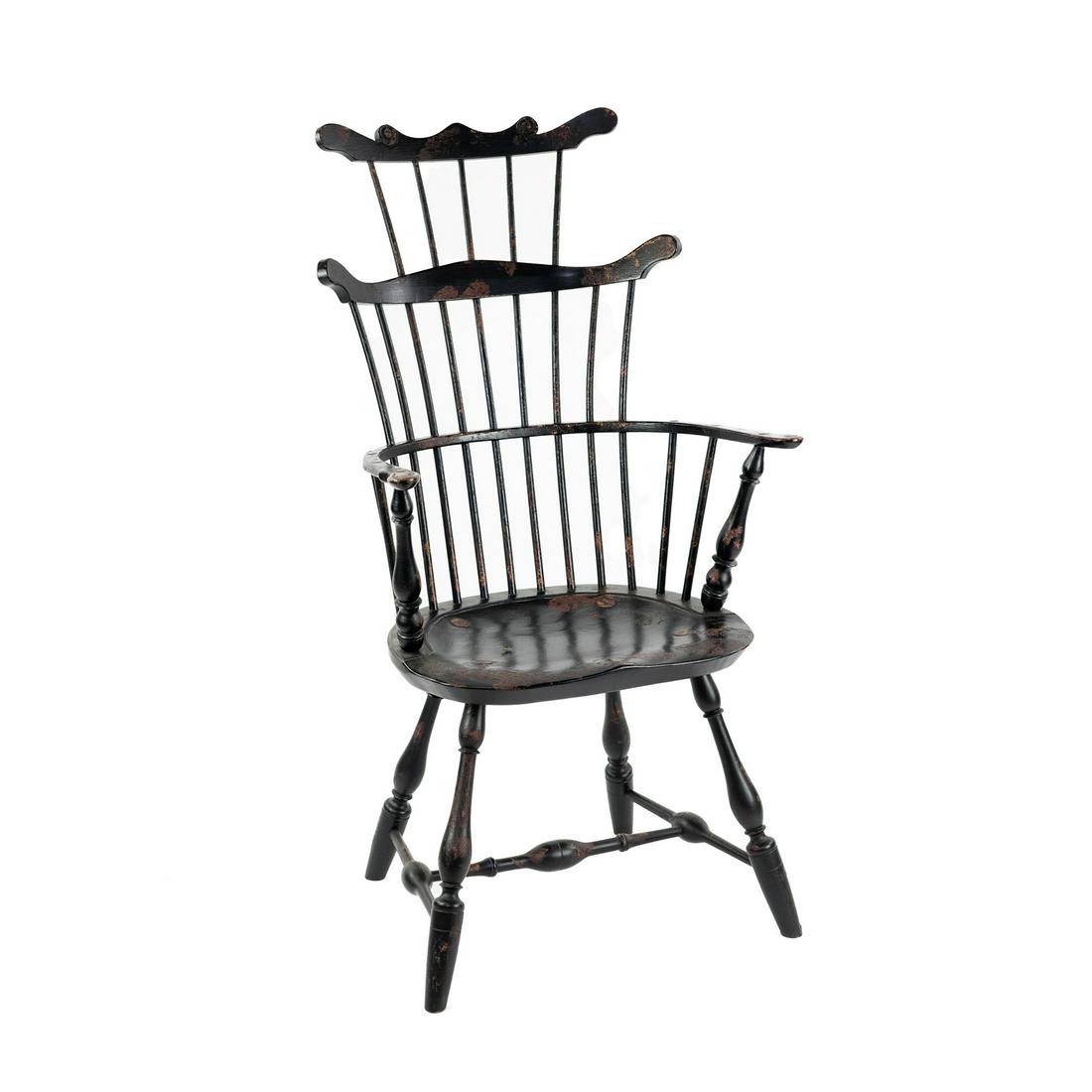 W. Wallick Comb Back Windsor Chair: A comb back Windsor chair painted black with a carved scroll pattern crest rail and turned legs joined by an H stretcher. Marked on seat underside 'W. Wallick'. Seat height: 18"