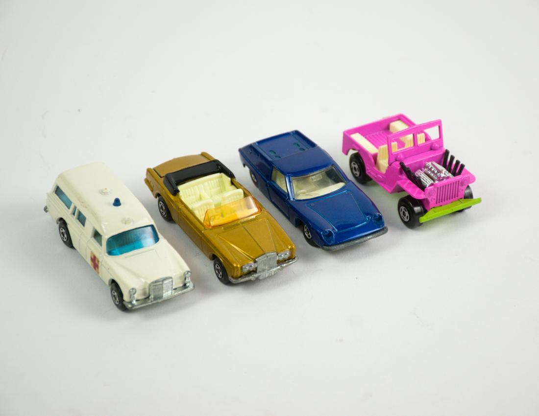 4 Vintage Lesney Matchbox Diecast Cars: A group of 4 vintage Matchbox diecast collectible cars made in England - a 1969 series 69 Rolls Royce Silver Shadow Coupe, a series 3 Mercedes Benz Ambulance, a 1969 series 5 Lotus Europa, a 1971 seri