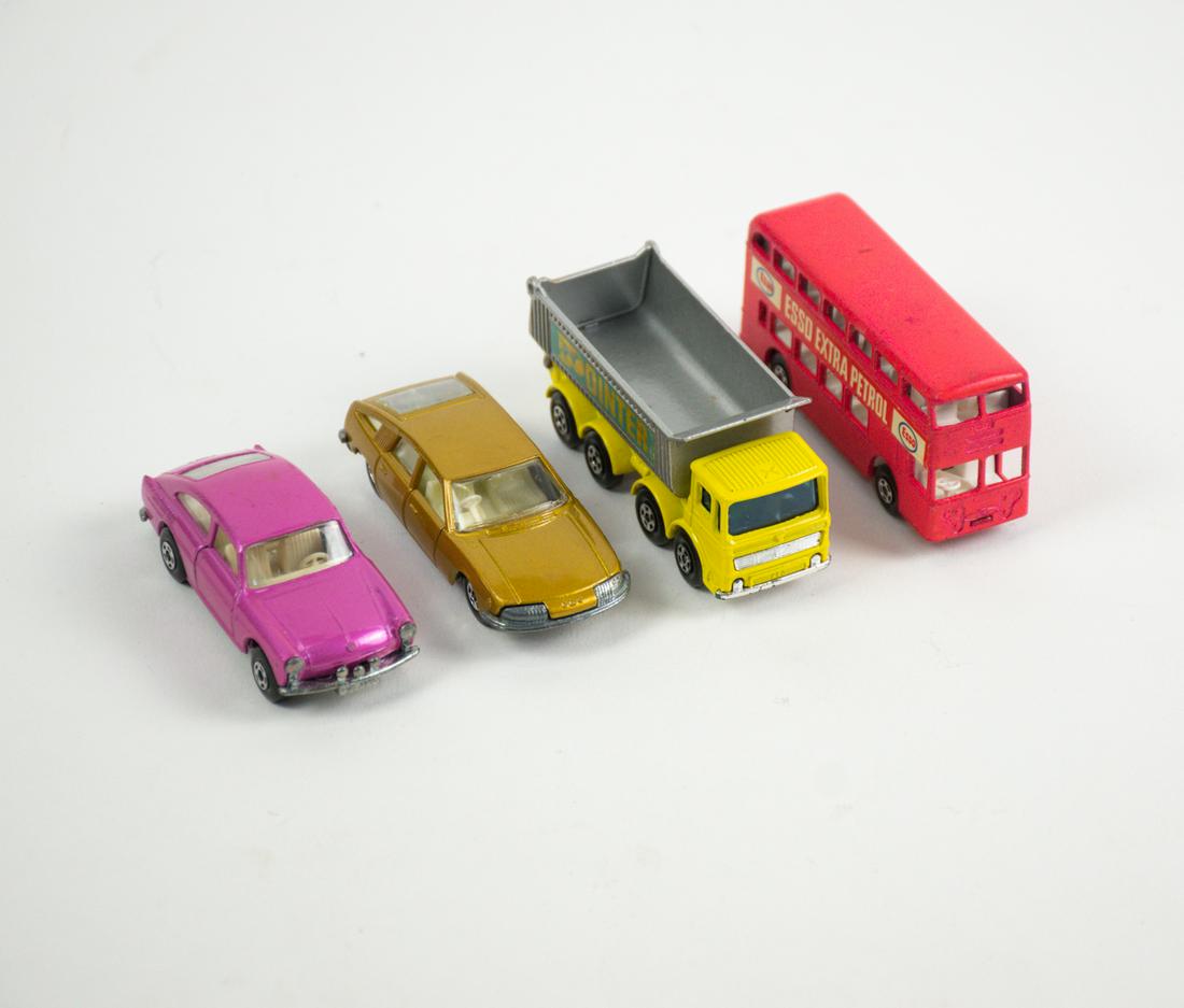 4 Vintage Matchbox Diecast Collectible Cars: A group of 4 vintage Matchbox diecast collectible cars made in England - an Esso Extra Petrol double decker bus, an 8 wheel tipper "Pointer" dump truck, a BMC 1600 Pininfarina car, a Volkswagon 1600 T