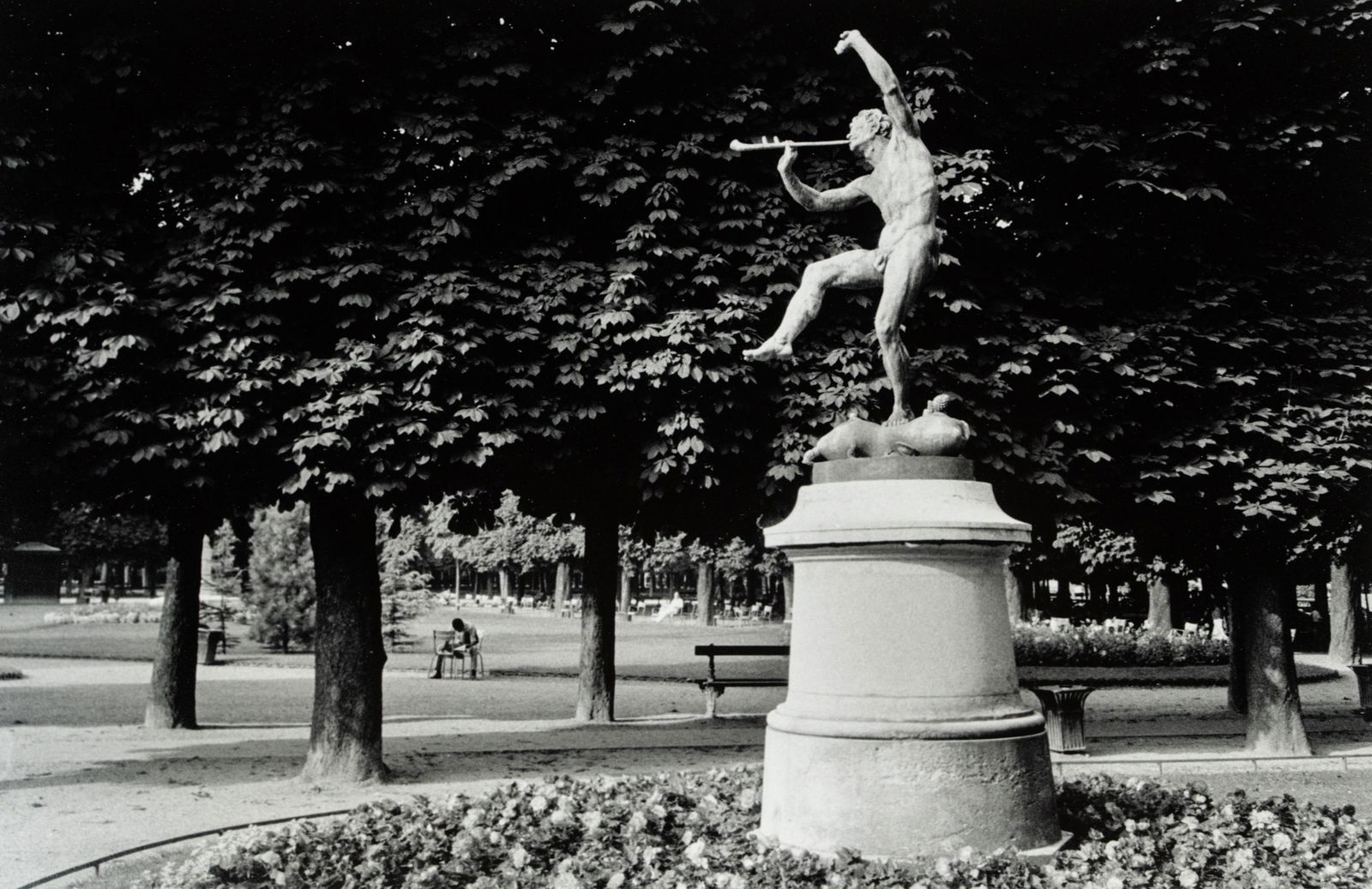 John Eide Jardins du Luxembourg Signed Photograph Print: A John Eide (American, 1943-) black and white silver gelatin photograph print titled "Jardins du Luxembourg" taken in 1983 depicting a statue in the Luxembourg Gardens. Signed in pencil in lower right