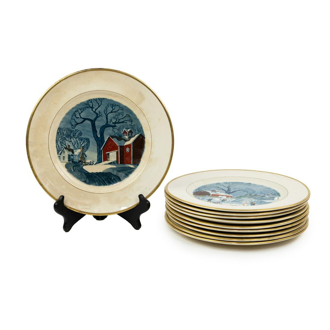 (10) Adams China Red Barn First Edition Service Plates: A group of 10 Adams China England First Edition 'Red Barn' series dinner plates after the works of Dale Nichols (American, 1904 - 1995) featuring a different red barn corresponding to each month of th