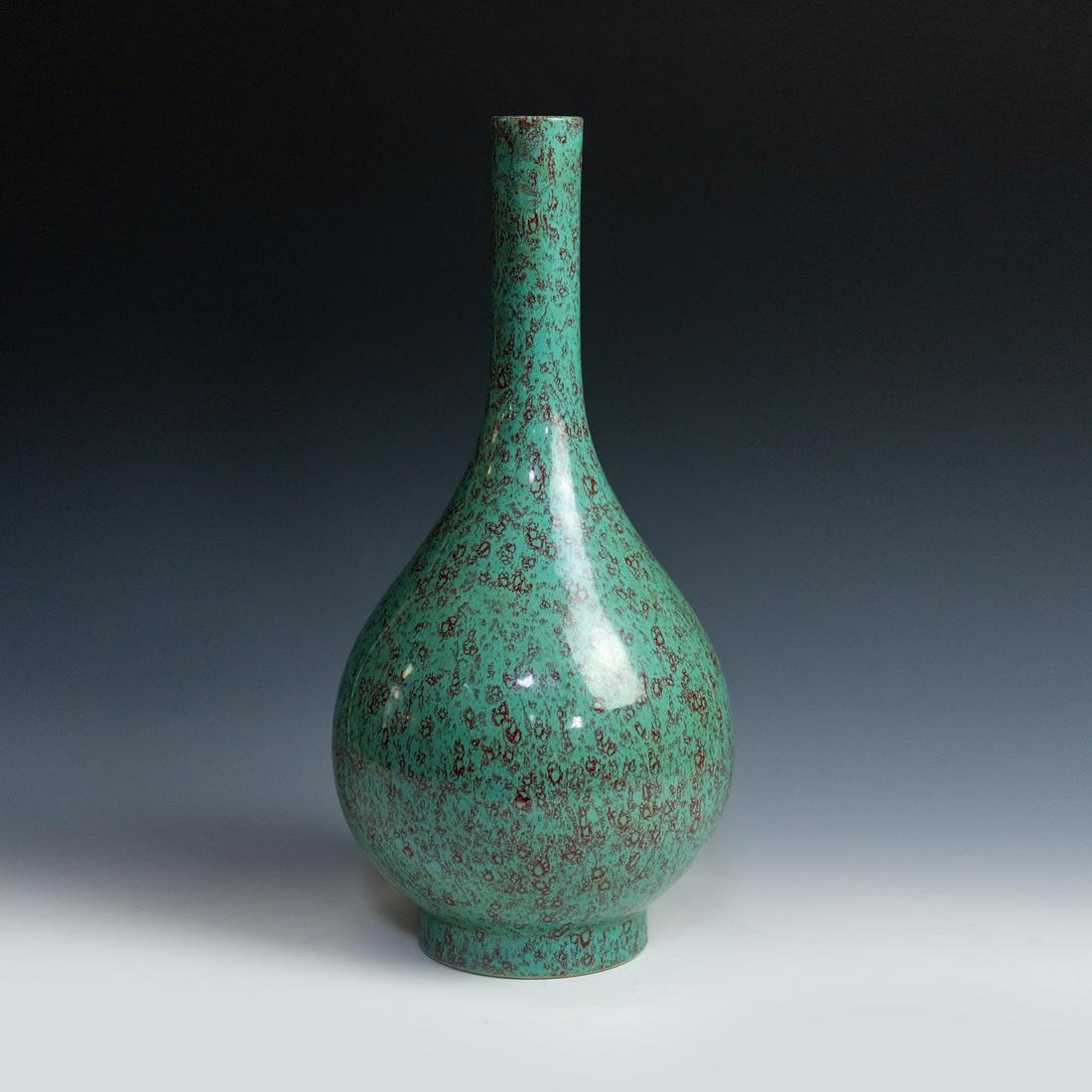 Chinese Qing Qian Long Lu Jun Glaze Bottle Vase: A Chinese Da Qing Qian Long Lu Jun glaze bottle vase having rich green glaze with red speckling throughout. Marked on underside.