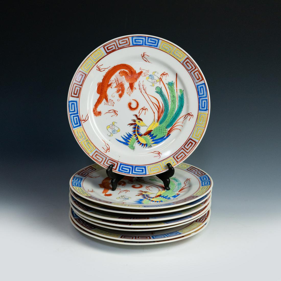 (8) Qing Qian Long Painted Dragon and Phoenix Motif Plates: A set of (8) eight antique Qing dynasty Da Qing Qian Long porcelain painted dragon and phoenix chasing the flaming pearl motif plates.