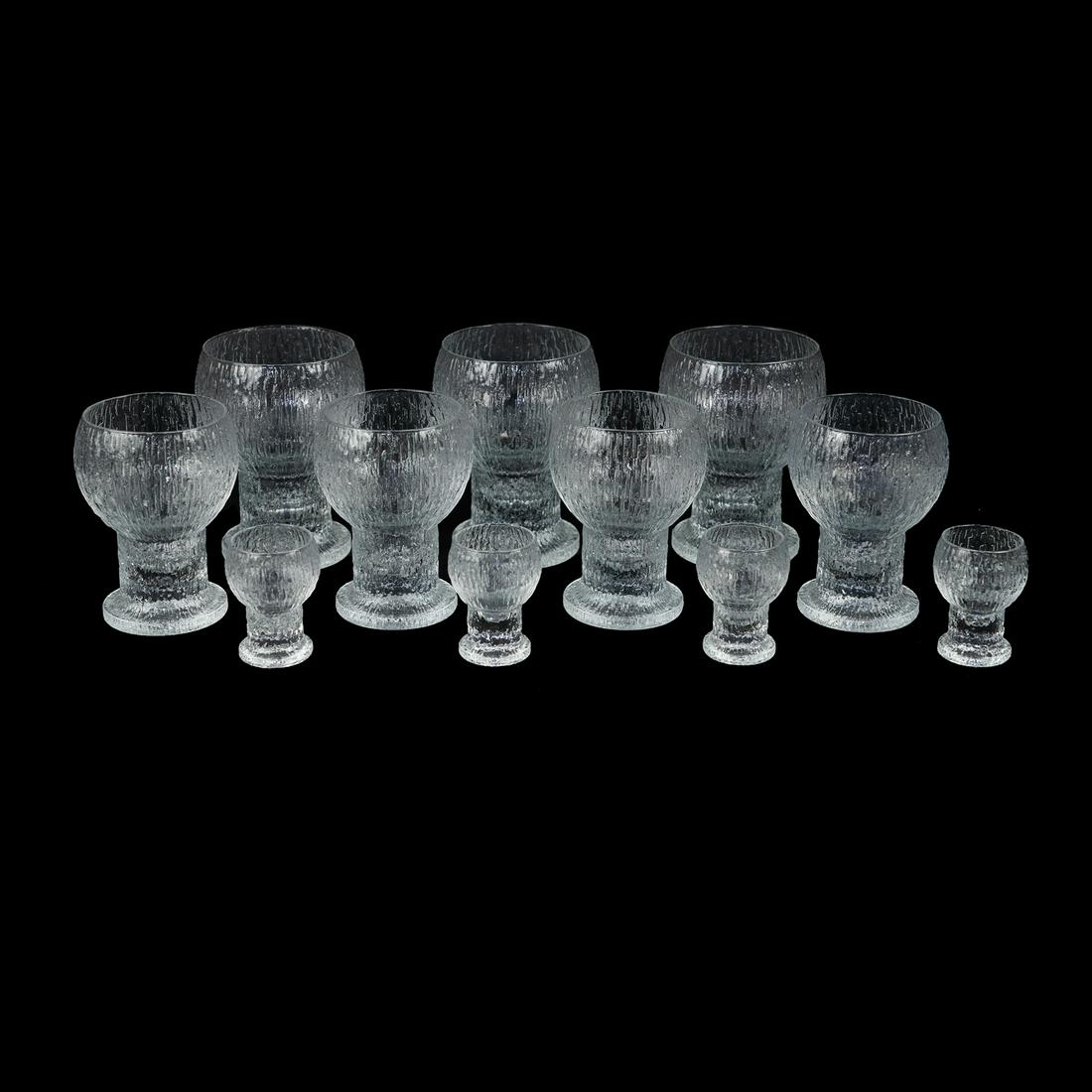 (11) Iittala Kekkerit Ice Goblets and Shot Glasses: A set of eleven (11) Timo Sarpaneva for Iittala "Kekkerit" Ice pattern glasses including 7 water goblets and 4 shot glasses.