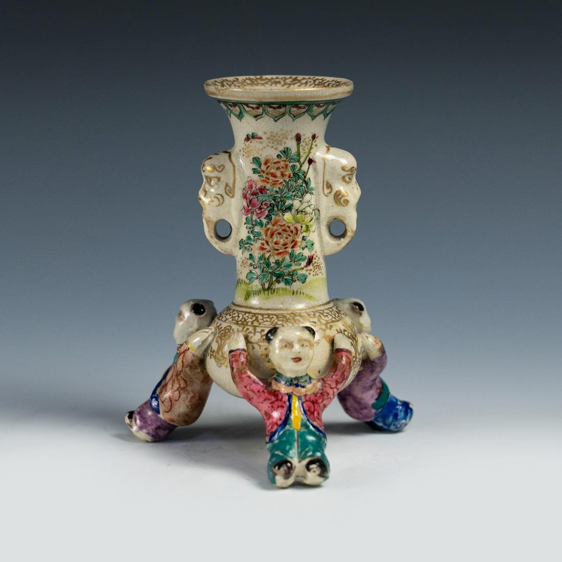Chinese Jinzhishan Tripod Figural Epergne Vase: An antique Chinese Jinzhishan tripod epergne vase having a central cylindrical vase supported by three figural supports in the form of children with elephant grabs and intricately painted chrysanthemu