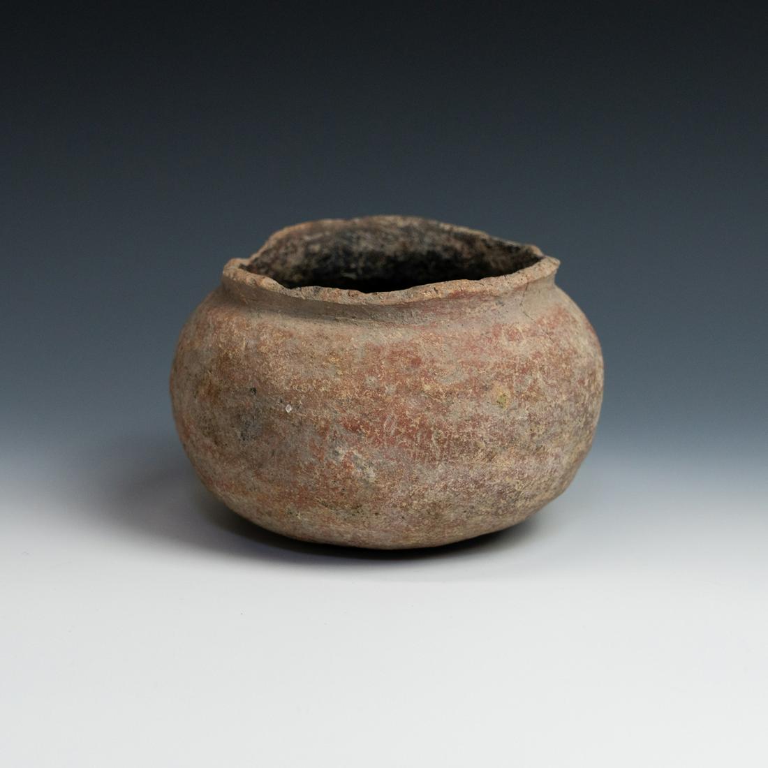 Prehistoric Ban Chiang Thailand Pottery Bowl: A prehistoric Ban Chiang (Thailand) pottery bowl circa 380-249 BC having a bulbous body with a red painted exterior and black painted interior. From the collection of Lisa Royse, Atlanta, GA.