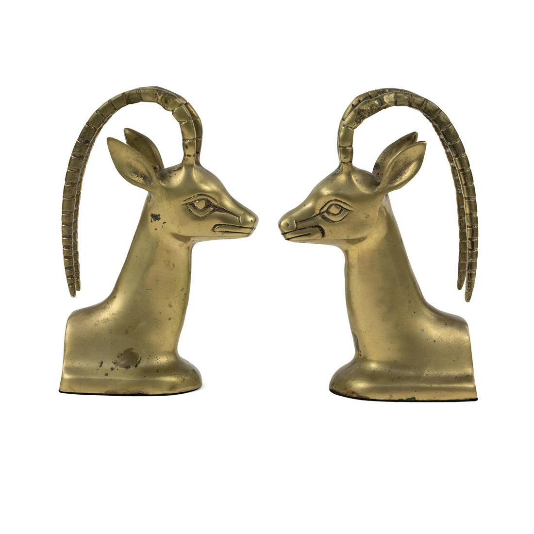 (2) Pair of Brass Ibex Bookends After Alain Chervet: A pair (2) of brass ibex bookends designed after Alain Chervet depicting the horned animals heads back to back. Unmarked.