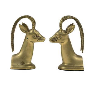 (2) Pair of Brass Ibex Bookends After Alain Chervet: A pair (2) of brass ibex bookends designed after Alain Chervet depicting the horned animals heads back to back. Unmarked.