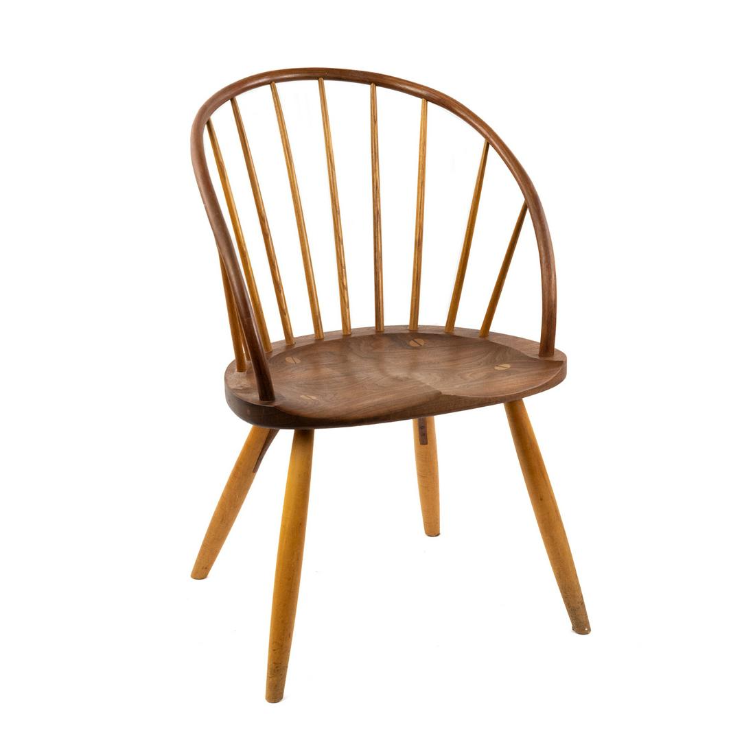 Thomas Moser Walnut and Ash 'Bowback' chair: A Thomas Moser 'Bowback' spindle chair in walnut and ash with saddle seat, spindle back splats. Seat height: 17.5" SHIPPING Atlanta Auction Gallery will not ship this lot in house. The buyer is respon
