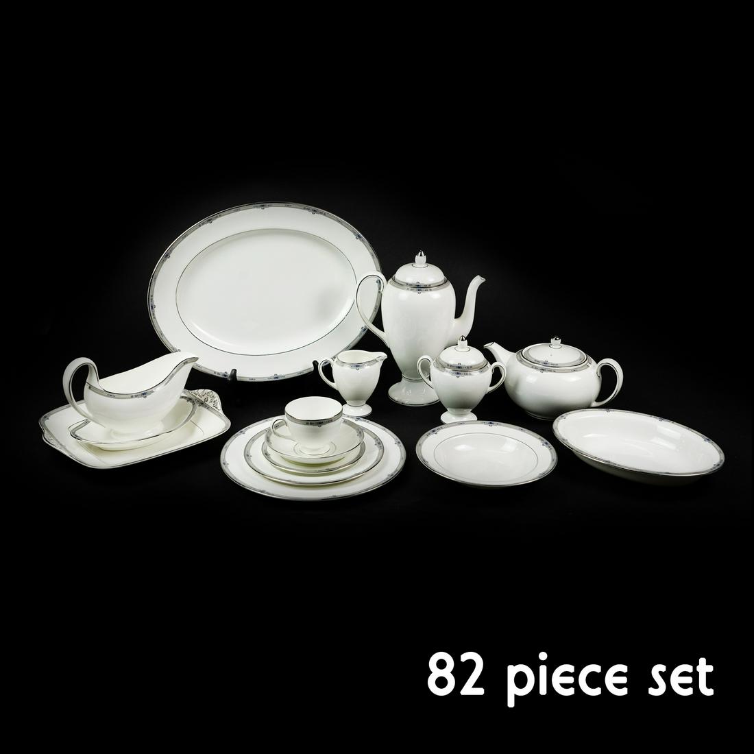 82 pc. Set of Wedgwood 'Amherst' Dinner Service: An 82 piece set of Wedgwood England Bone China 'Amherst' pattern dinnerware with platinum trim and royal blue accents. The set includes 12 dinner plates, 12 salad plates, 12 bread & butter plates, 10