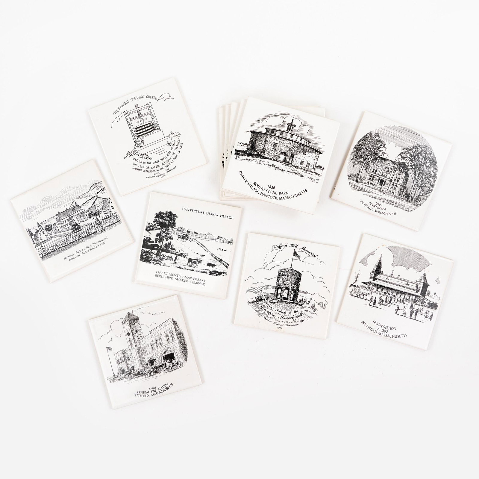 (12) Sheffield Pottery Shaker Decorative Tiles: A group of twelve (12) Sheffield Pottery decorative Shaker tiles having cork backs including a 'Union Station' tile with info page on back, a '1890's Court House' tile with info page on back, five '18