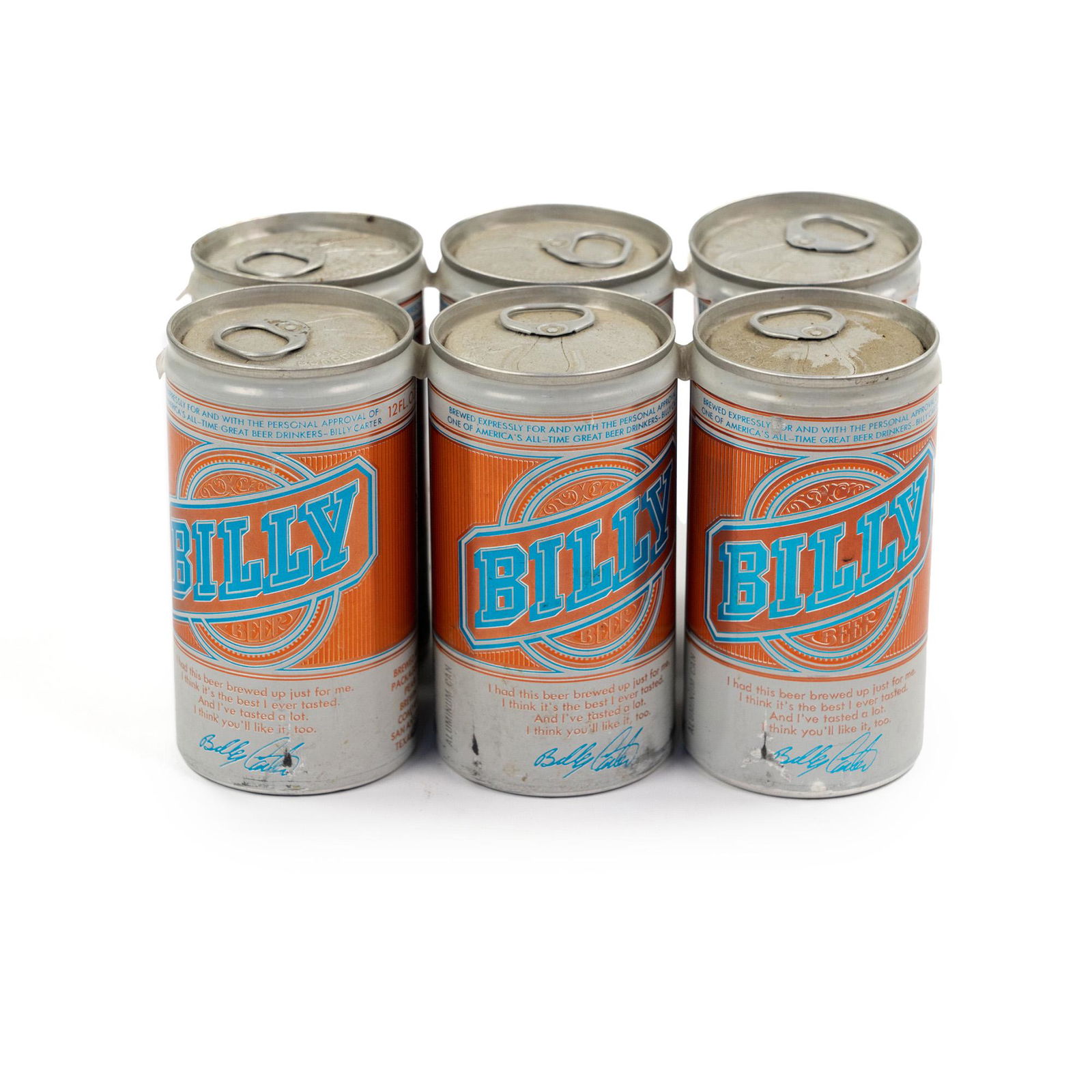 (6) Vintage 'Billy' Beer Cans on Plastic Ring: A group of six (6) vintage unopened 'Billy' brand orange and white beer cans on plastic ring. 'Billy' was a brand of beer promoted by Billy Carter, older brother of former U.S. President Jimmy Carter.