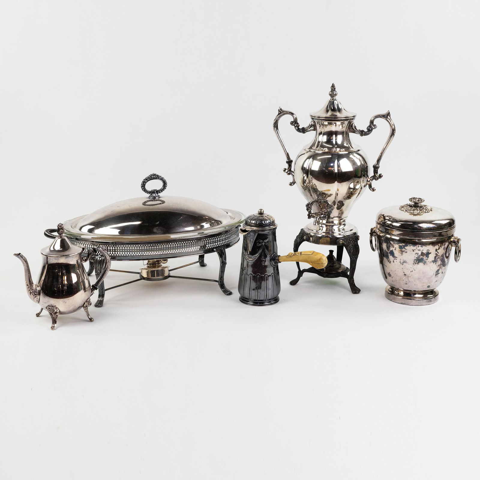 (5) Silver Plate Dishware - Leonard, Sheridan: A group of five (5) pieces of silver plate serveware including a Bazar Colon Turkish style coffee pot having a side mounted bone handle with carved rose, a Sheridan Silver Company samovar having two h