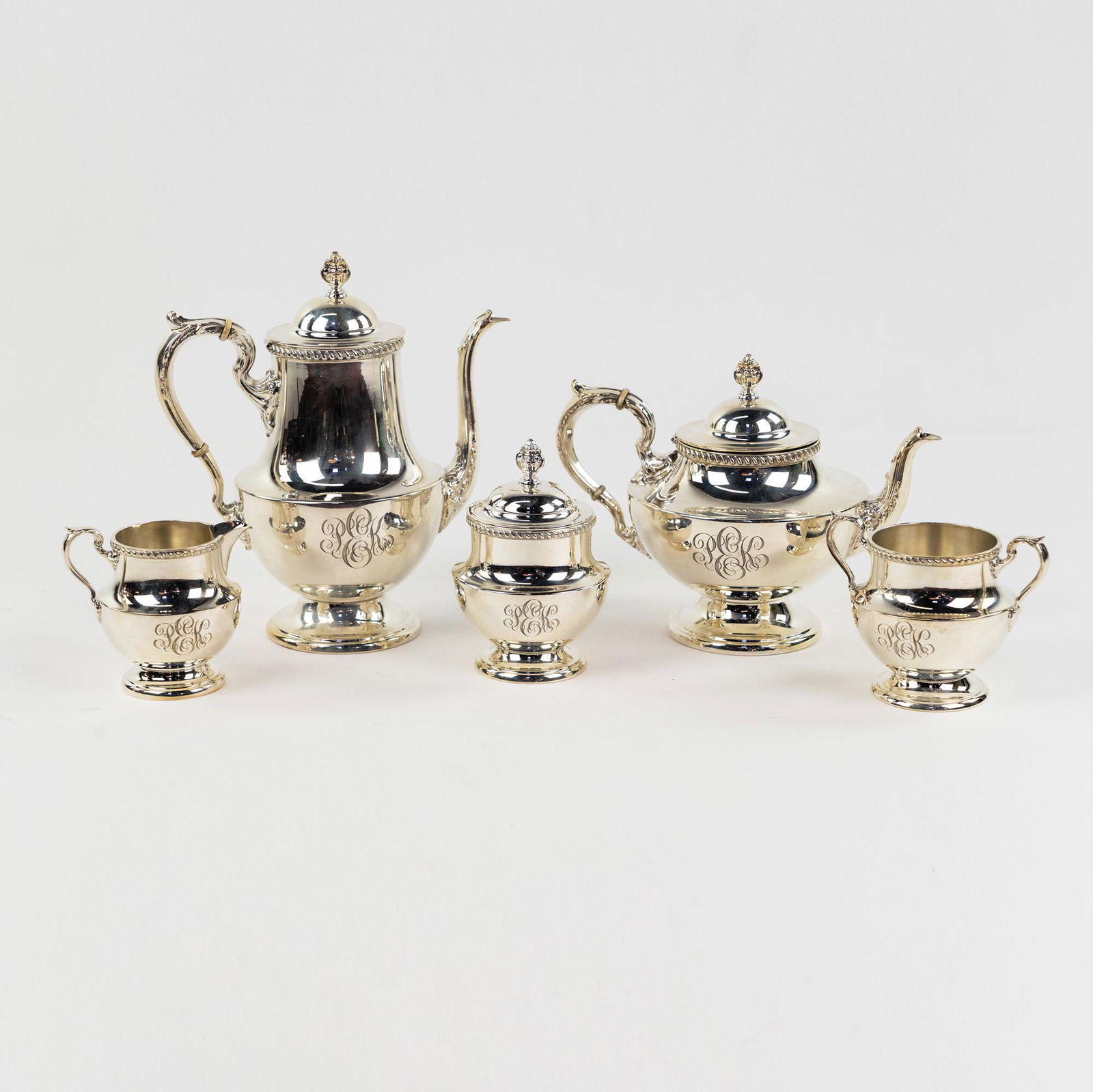 (5) Poole Georgian Pattern Sterling Silver Service Set: A set of five (5) Poole Georgian pattern sterling silver serveware including a coffee pot, a tea kettle, a creamer, a sugar bowl, and waste bin. All monogrammed 'PEK' along sides and marked on undersi