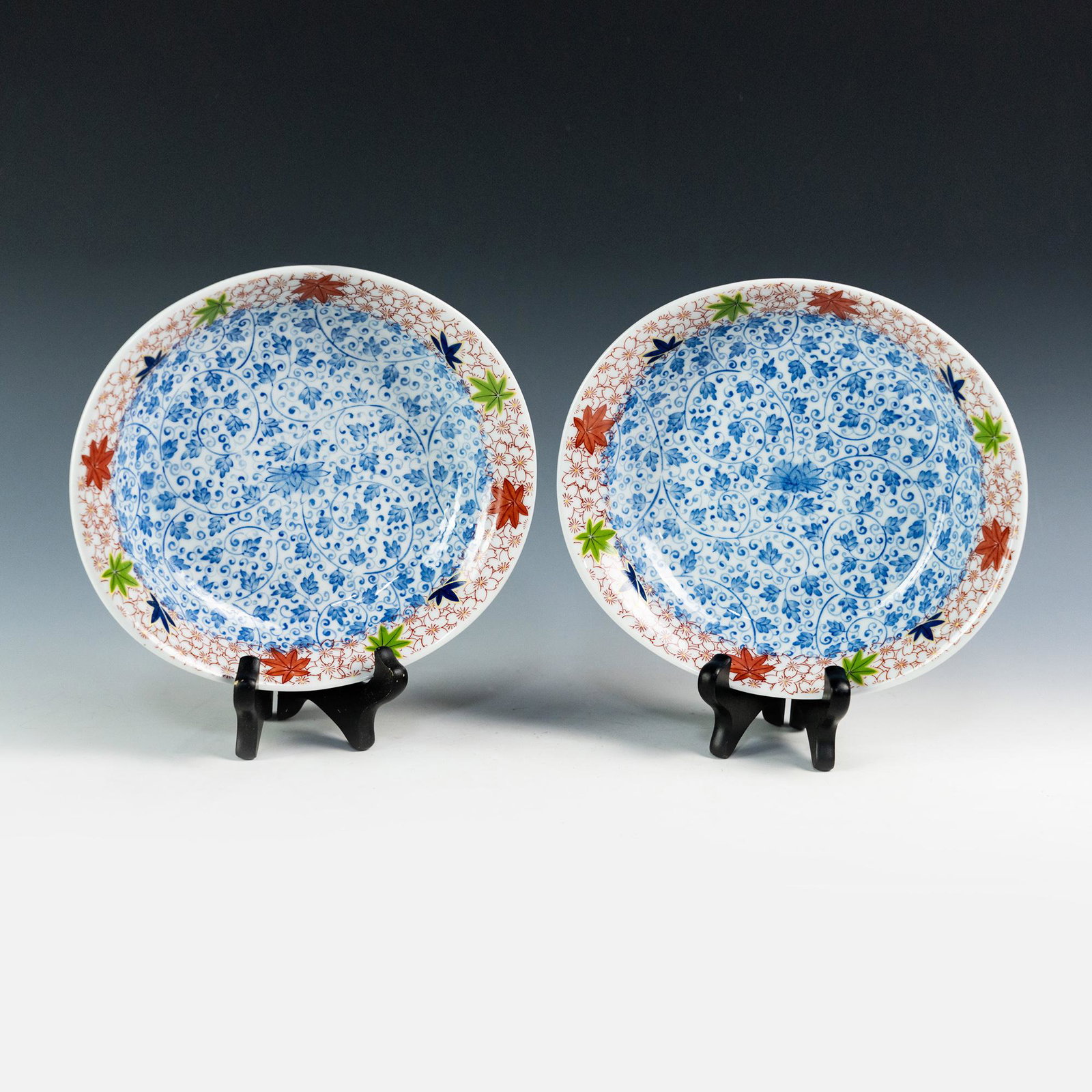 (2) Chinese Qingxiu Hand Painted Chinese Porcelain Bowls: A pair of Chinese Qingxiu porcelain bowls having intricate blue, red, and green floral pattern. Marked Qing Xiu on underside and applied sticker reading 'Property of John A. Williams'.