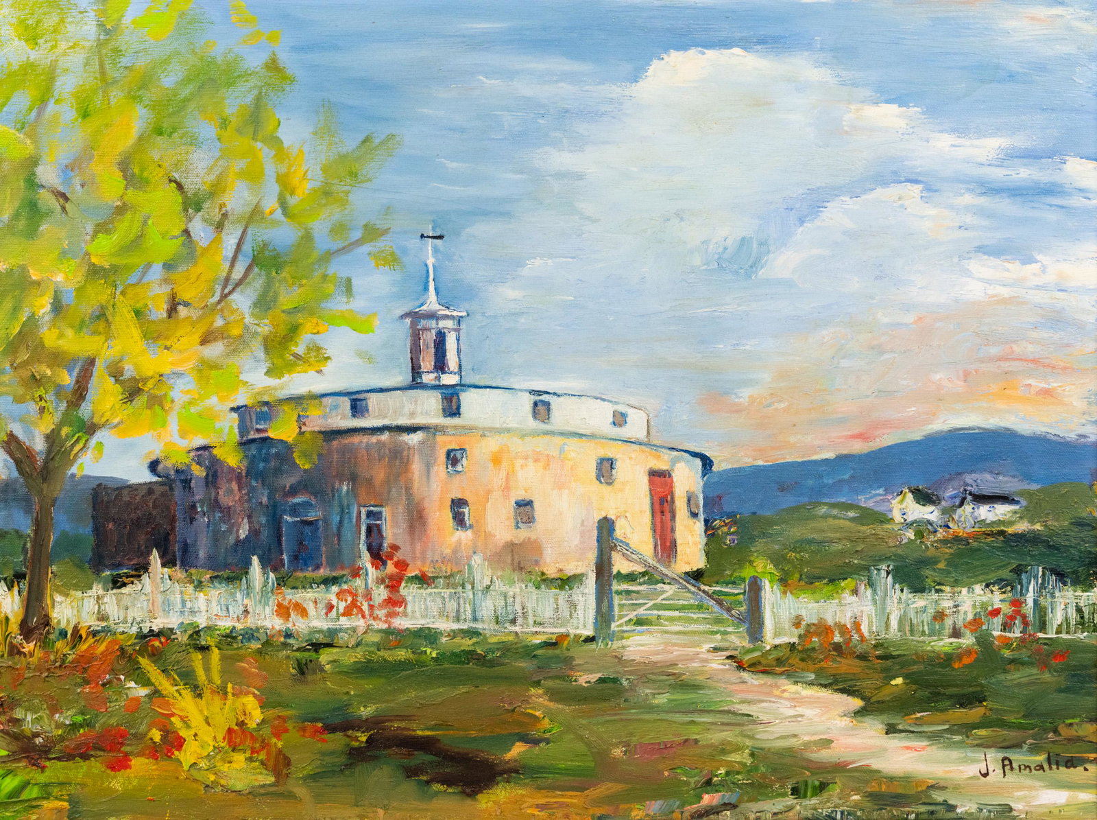J. Amalia Oil on Canvas of a Church in a Meadow: A J. Amalia oil on canvas painting depicting the Shaker Church Family Round Barn, on U.S. Route 20 in Hancock, MA. Signed J. Amalia lower right. Signed Amalia M. Lassiter 1972 on back. Housed in wood 
